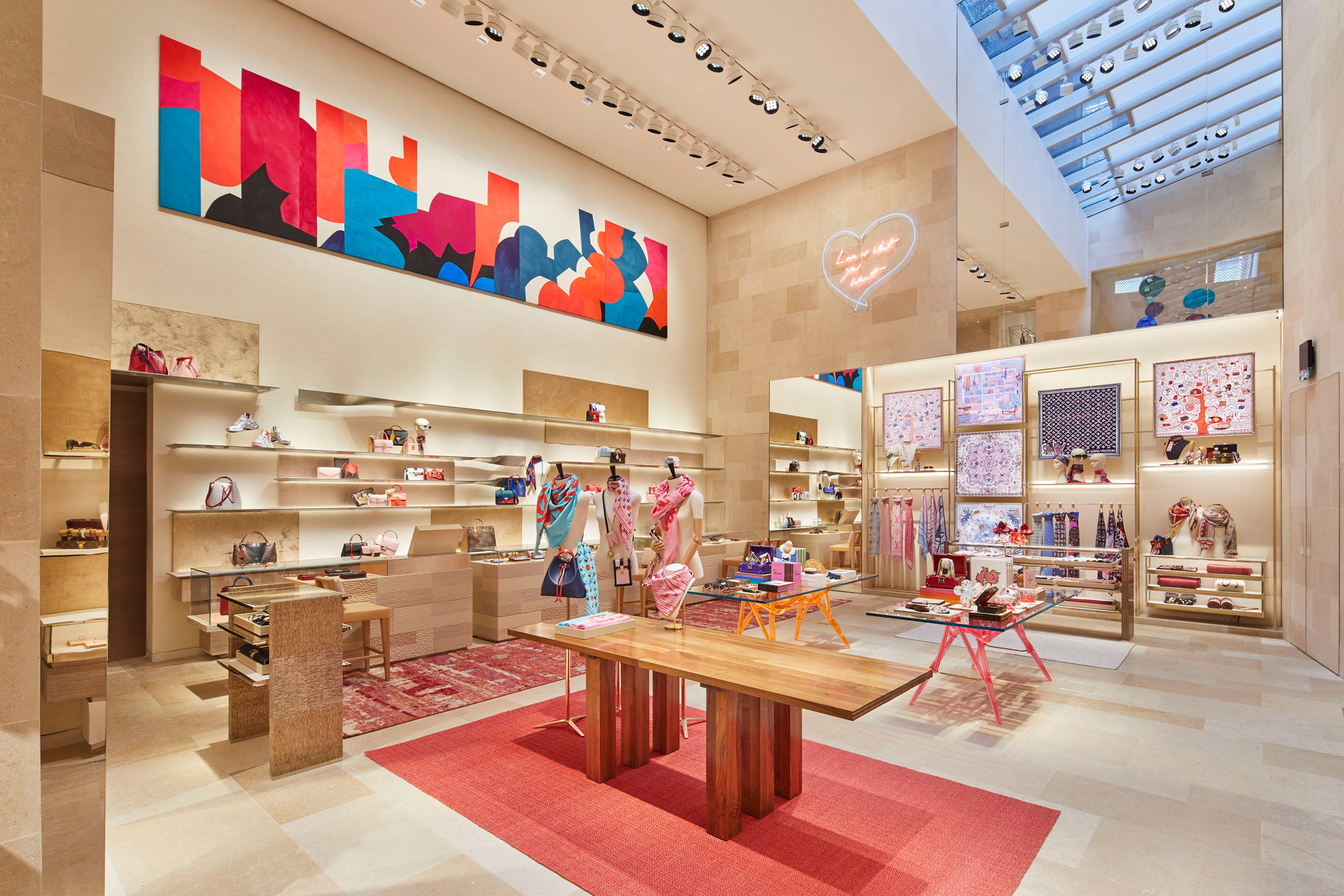 Louis Vitton's flagship store stands out with its red carpet and cool wooden design