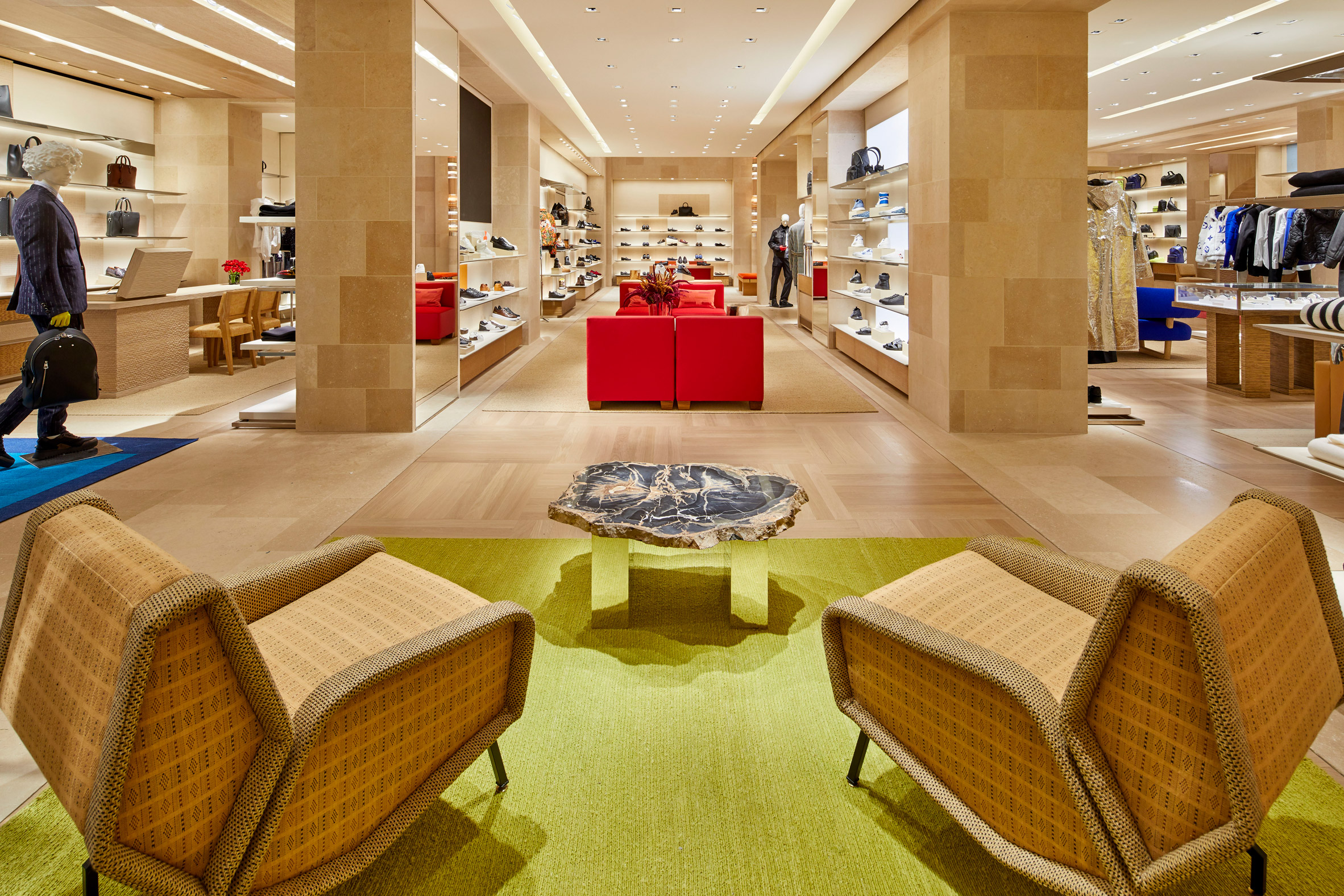 Louis Vitton flagship shop with lime carpet, sofas and products